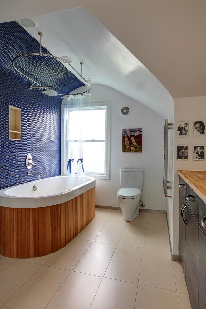 Small modern bathroom with oval bathtub