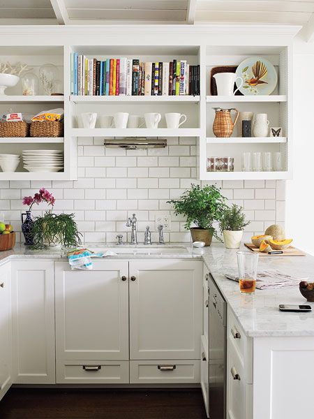 Small white kitchen with interesting shelves