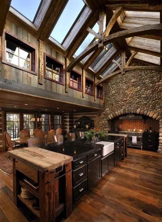 Spacious log cabin kitchen with long island in the middle