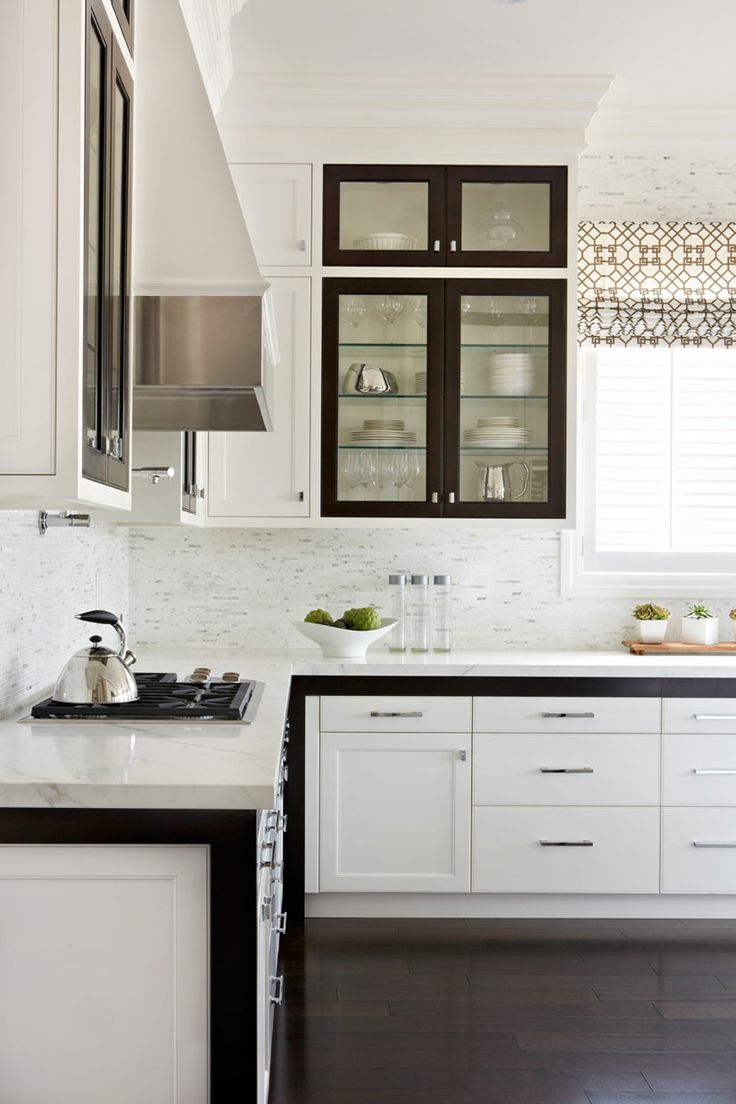 Stylish white kitchen with elegant black and brown accents