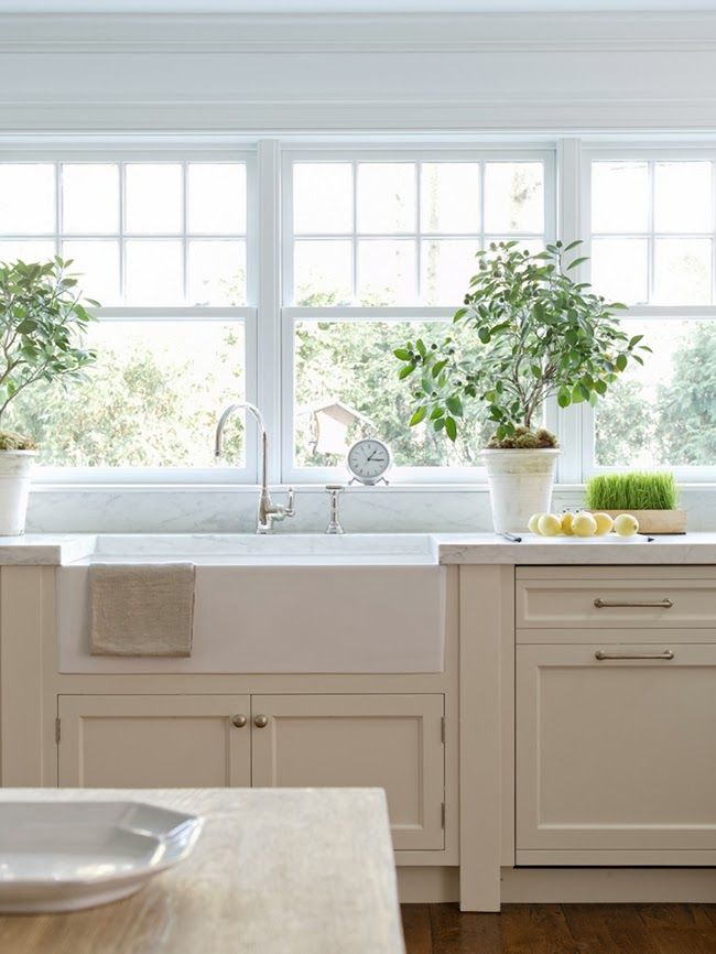 Sunny kitchen design with white cabinets