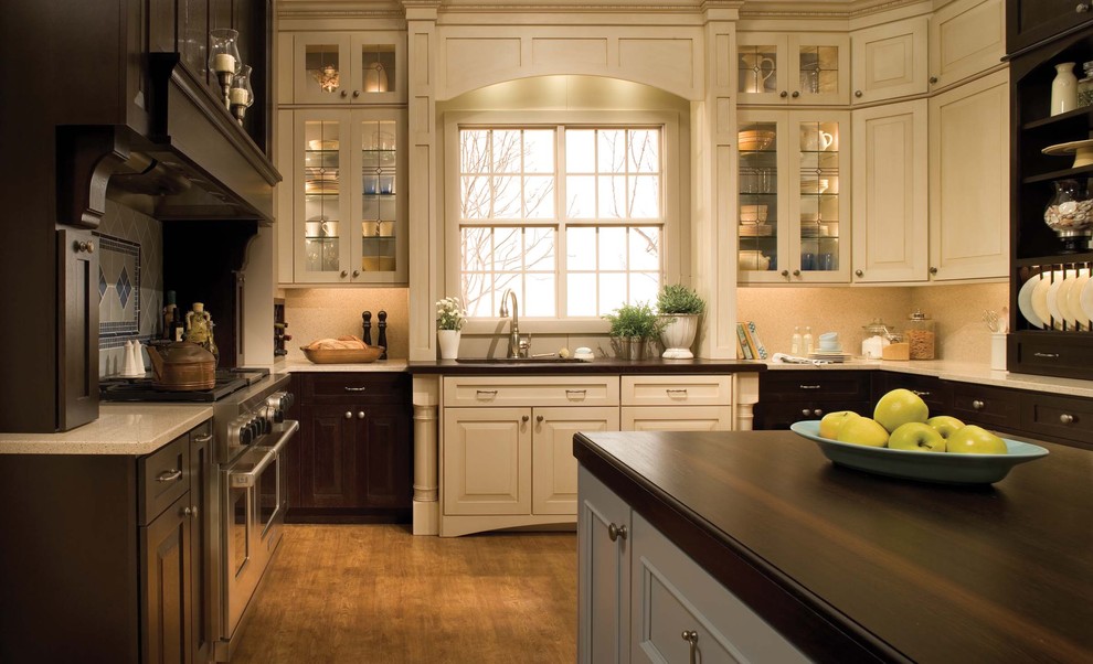 Traditional kitchen with decorative cabinet door insets