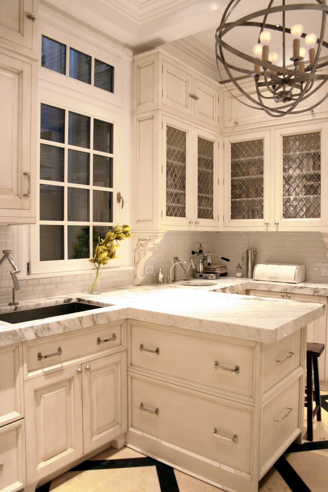 Traditional kitchen with white marble countertops