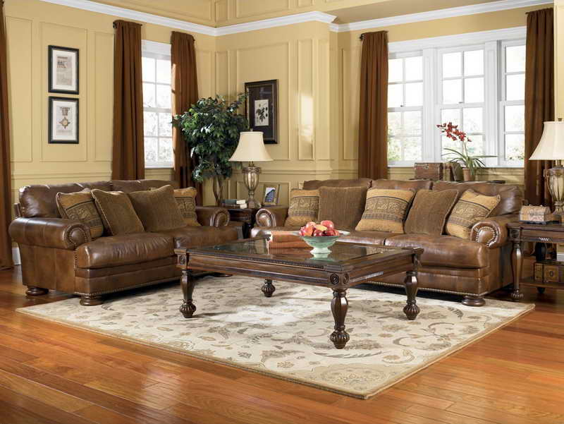 Traditional living room interior with dark brown leather sofas