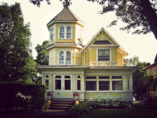 Vintage Victorian house with yellow facade