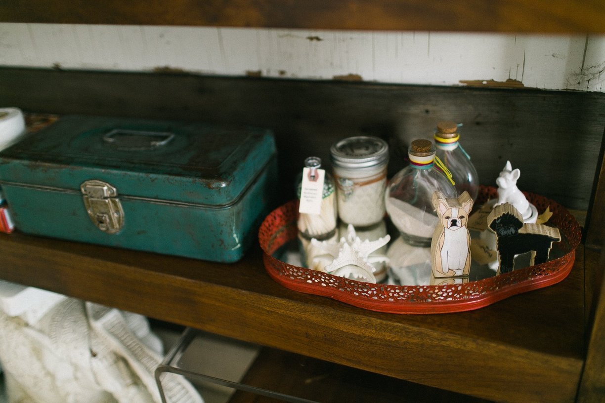 Vintage box decorates the reclaimed wood shelves