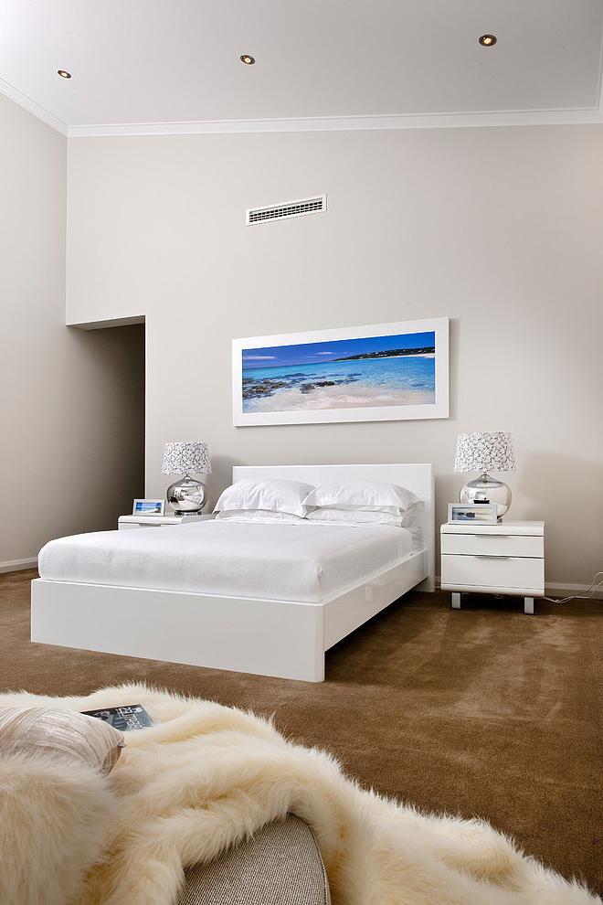 White bedroom design in a home near the ocean shore