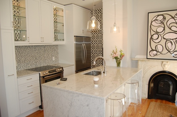 White kitchen island and abstract decorations in black