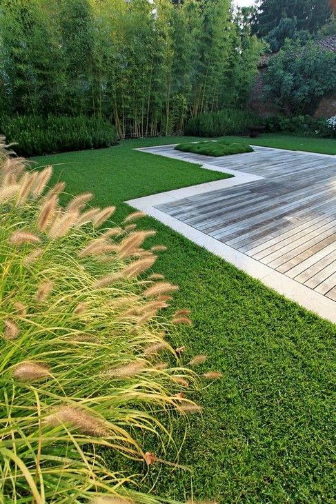 Wooden deck and grass outside the house