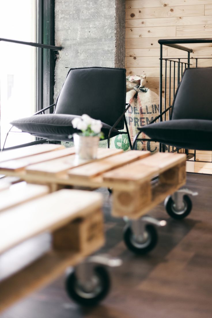 Creative cafe interior - with small tables made of palettes