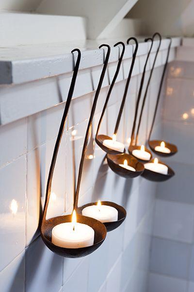 Creative candleholders used in the bathroom of the apartment