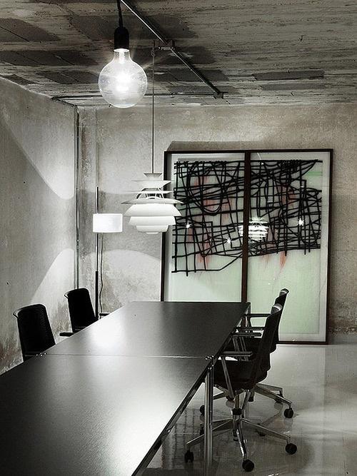 Industrial office conference room with abstract piece of art