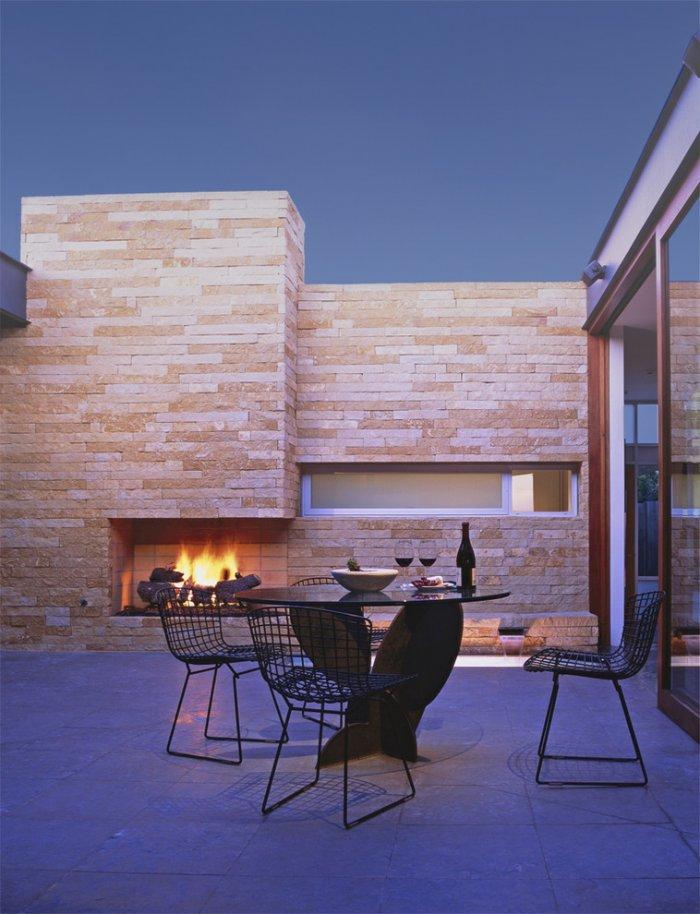 Minimalist porch - with patio furniture and outdoor fireplace