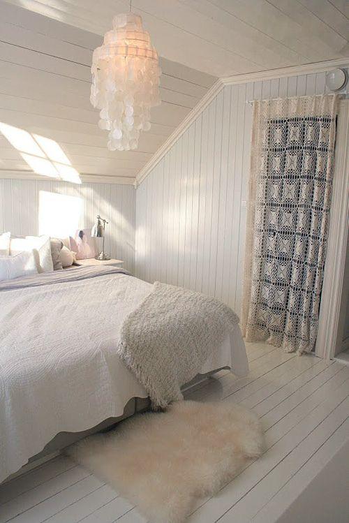 Scandinavian attic bedroom - with interesting crystal chandelier