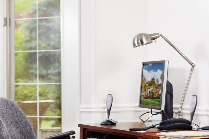 Sunny home office - with elegant wooden desk and small monitor