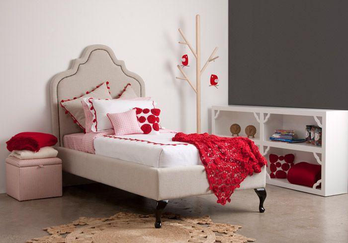 Teen single bed - with red accents in the room