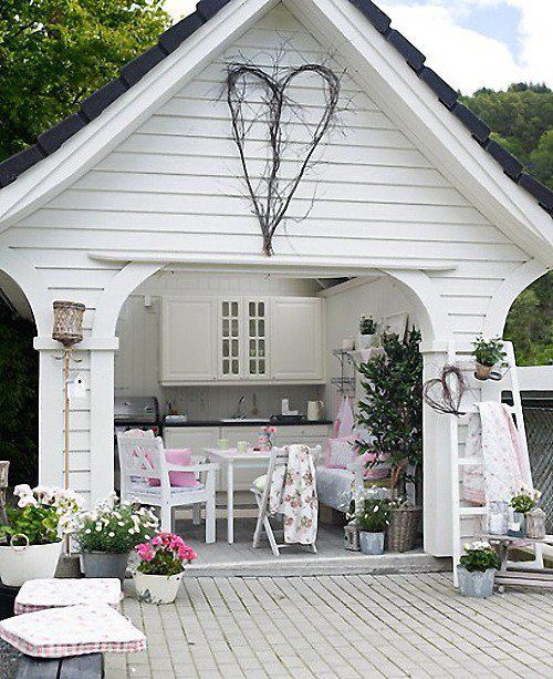 White shed with beautiful porch