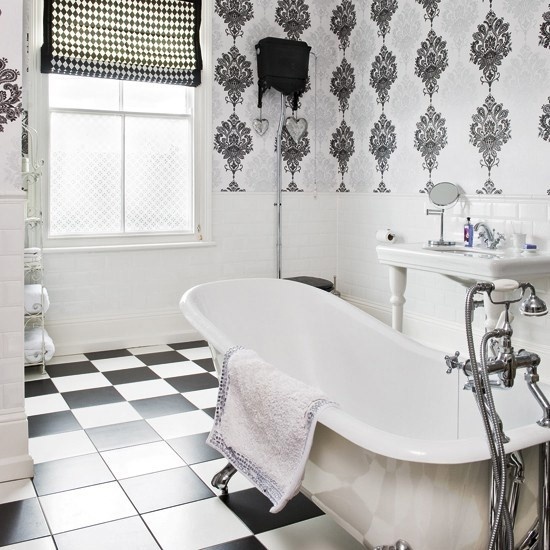 Apartment white bathroom - with bathtub and creative wallpaper patterns