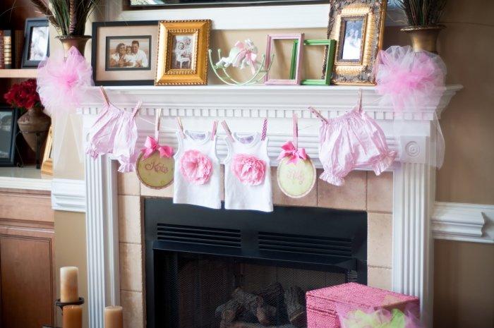 Baby shower surprises - a garland at the fireplace mantel