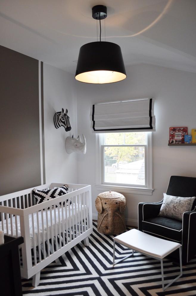 Black and white baby room - striped floor and graphic rugs