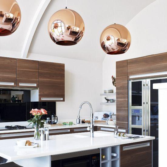 Contemporary stylish kitchen - with round copper pendants