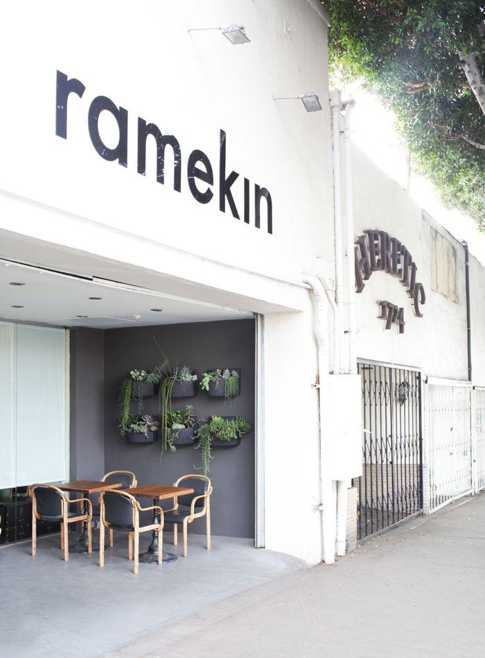 Creative white cafe facade - with niche where tables are placed