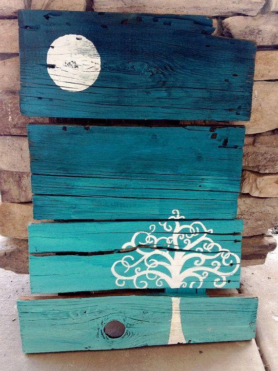 Decorative pallet art - painted in blue and displaying natural landscape