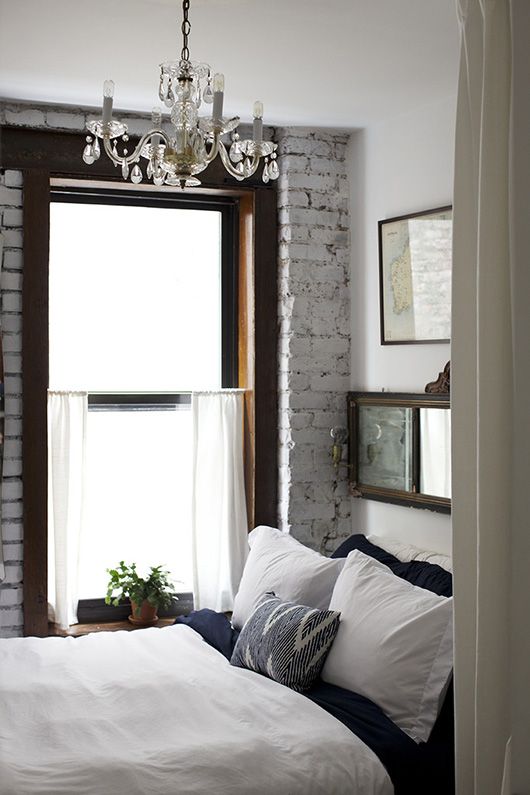 Eclectic bedroom - with classic crystal chandelier