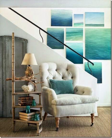 Eclectic staircase with paintings - of the ocean