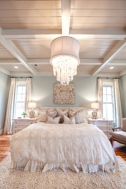 Eclectic White Bedroom With Barn Beams And Crystal