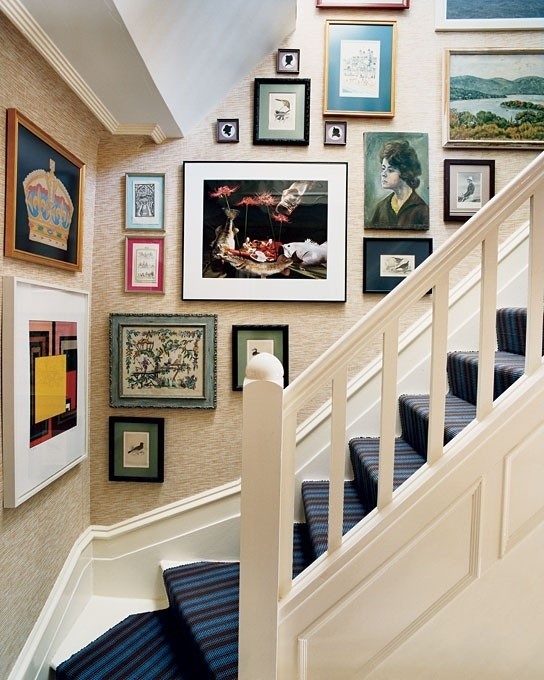 House staircase with images - portraits, landscapes and abstract art