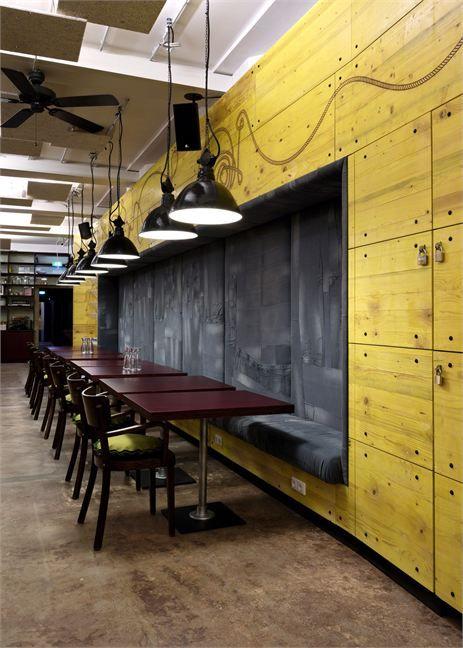 Industrial cafe interior - and yellow wall for a colorful accent