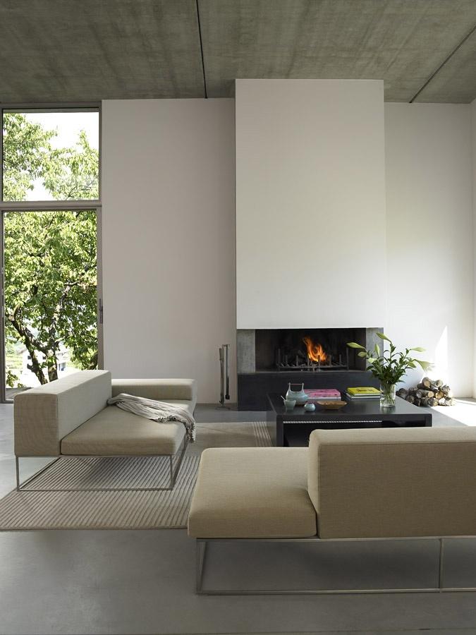 Minimalist living room - with stylish white fireplace in the background