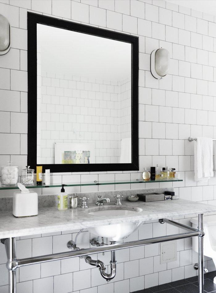 Mirror with black frame - in a modern small bathroom