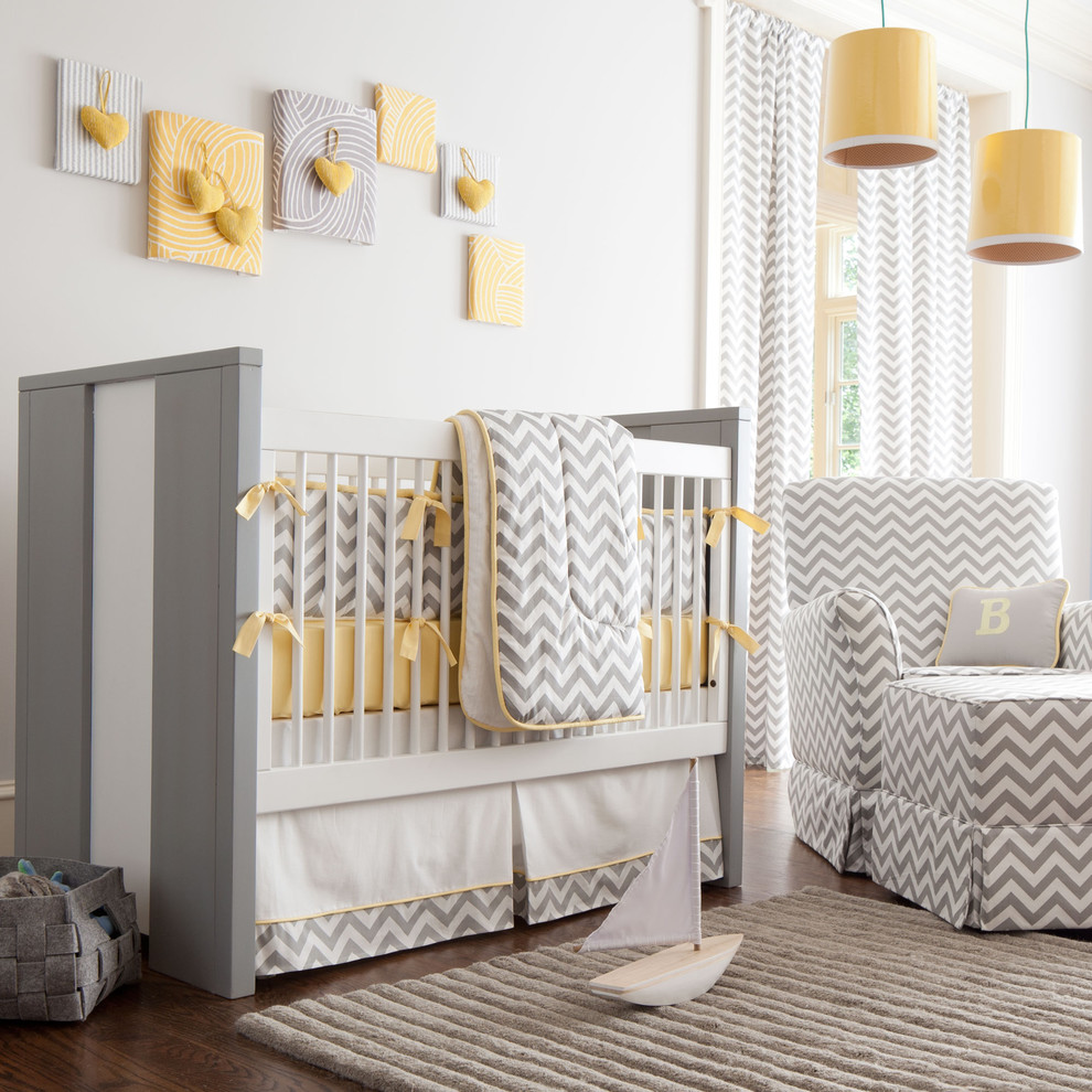 Modern baby crib - in a room with yellow pendants