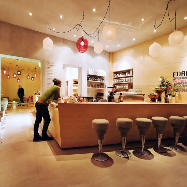 Modern cafe interior design with white contemporary bar stools