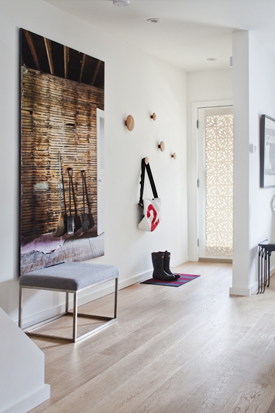 Modern stylish white bench - placed in the apartment entryway