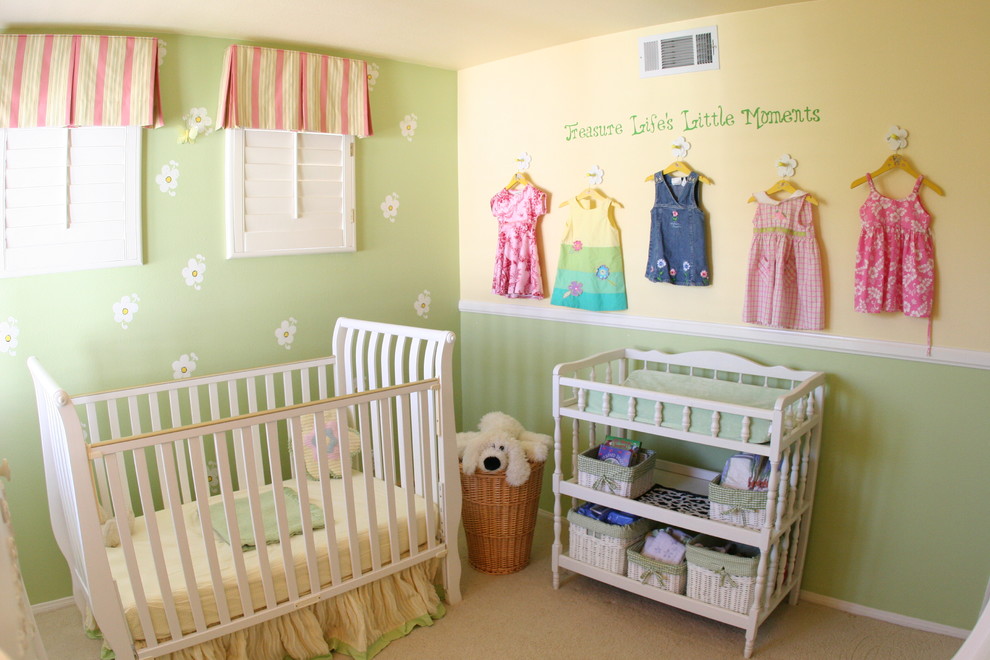 Pale colorful baby room - with small clothes decorating the wall