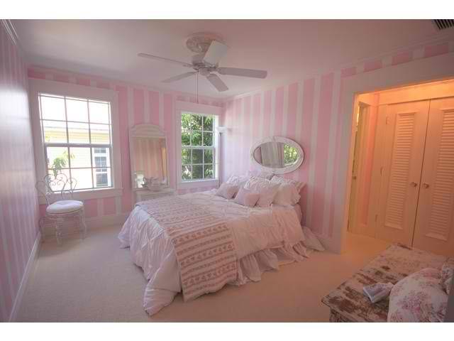 Pale pink bedroom - with stripe-painted walls