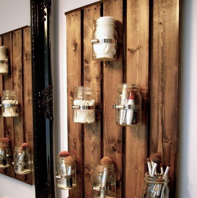 Pallet wall decor – with wood beams and hurricane jars ...