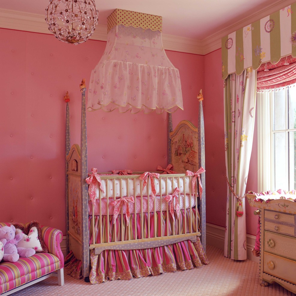 Pink baby crib - with decorative toys