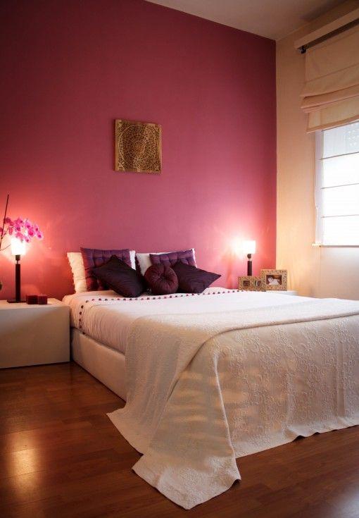 Pink bedroom wall - and white bed sheets