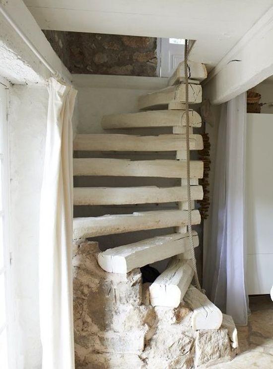 Rustic staircase design - with beams leading to the upper floor