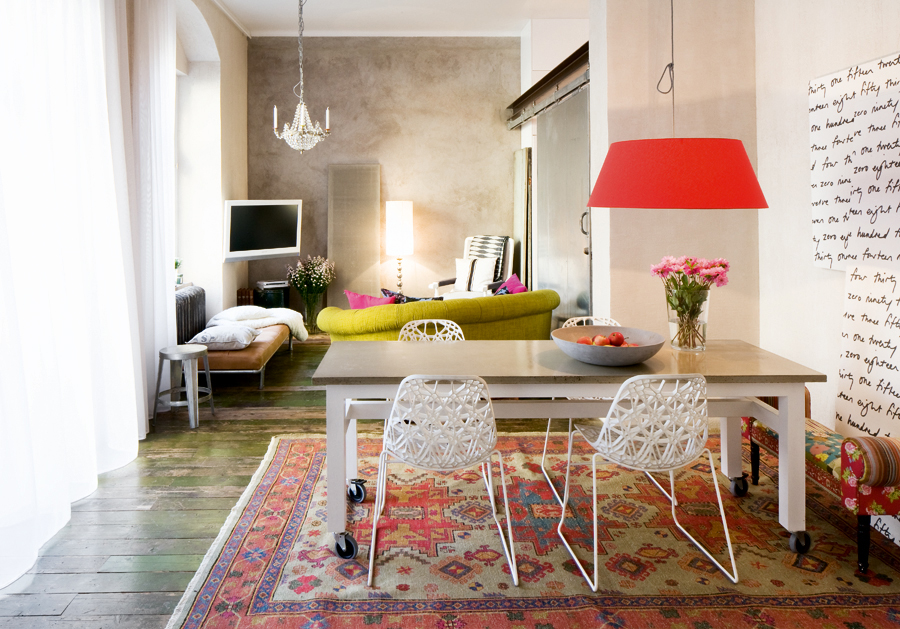 Small eclectic dining room - with colorful accents and red pendants