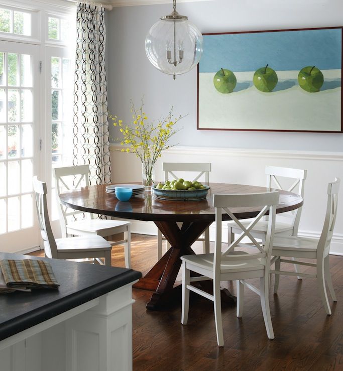 Small flat dining room - with round table and white chairs