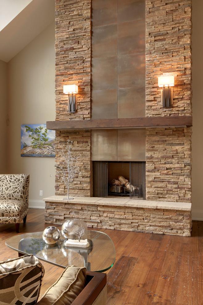 Stylish modern stone fireplace - with two lamps on both sides