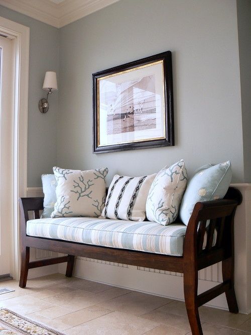 Traditional entryway bench - with pale cushions on it