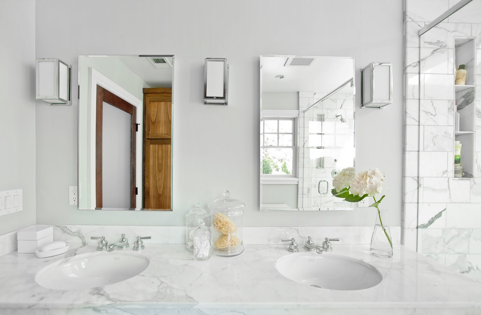 Two bathroom mirrors - placed in a large bath