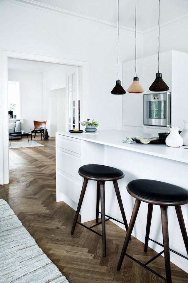 White Scandinavian kitchen - with modern black accents and bar stools