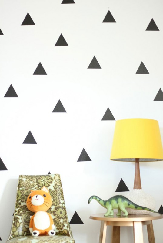 White paing and black triangles - creative decor in apartment